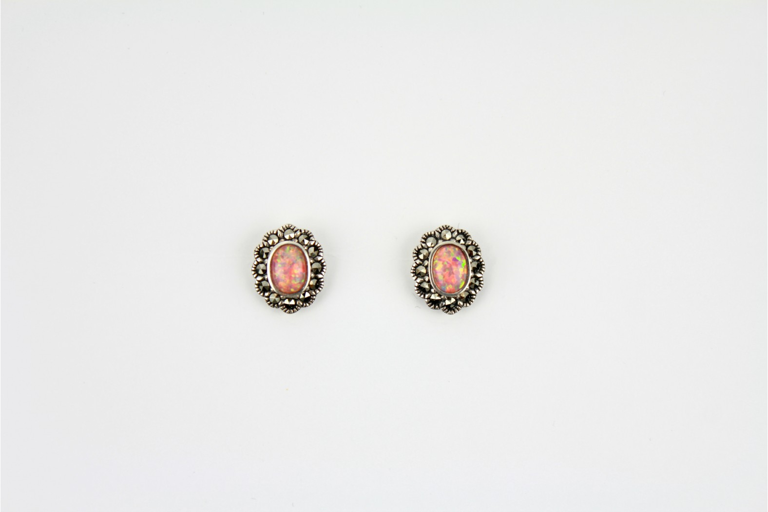 Gorgeous Coral Pink Opal Fire oval shaped studs surrounded with Marcasite stones