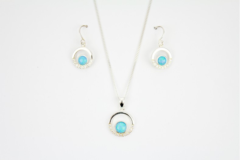 Beautiful Blue Opal Fire with cubic zirconia enhancements mounted within circular shapes complimentary short drop earrings on 18inch 45cm. cable chain.