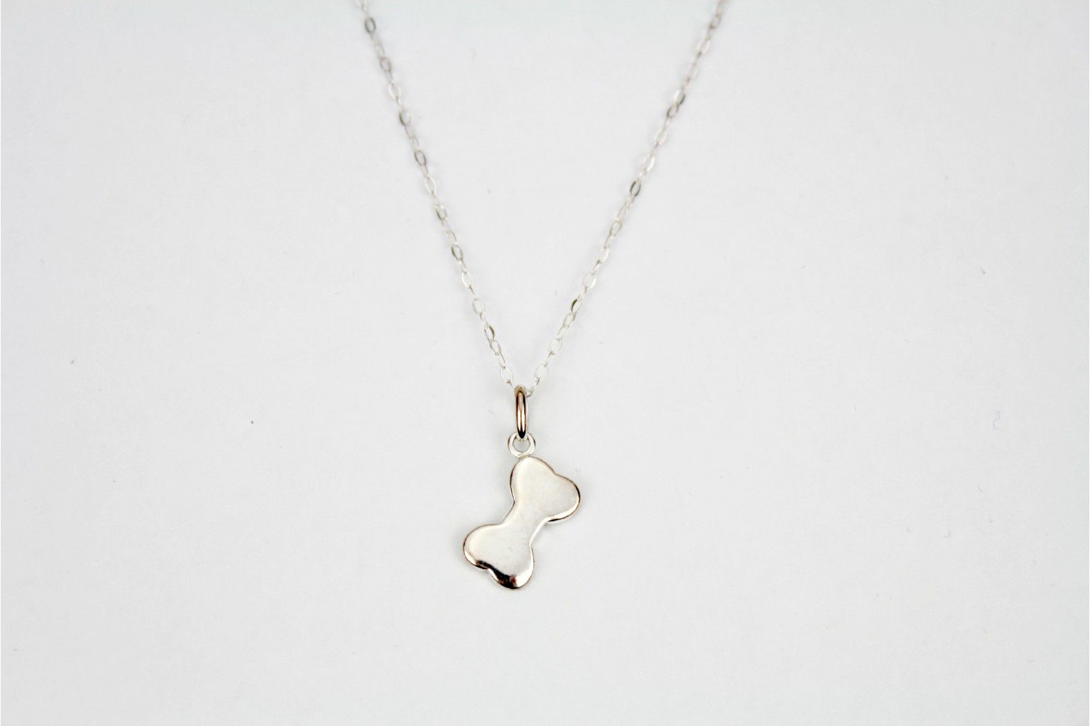Silver bone charm size pendant on 18ins 45cm light cable chain
