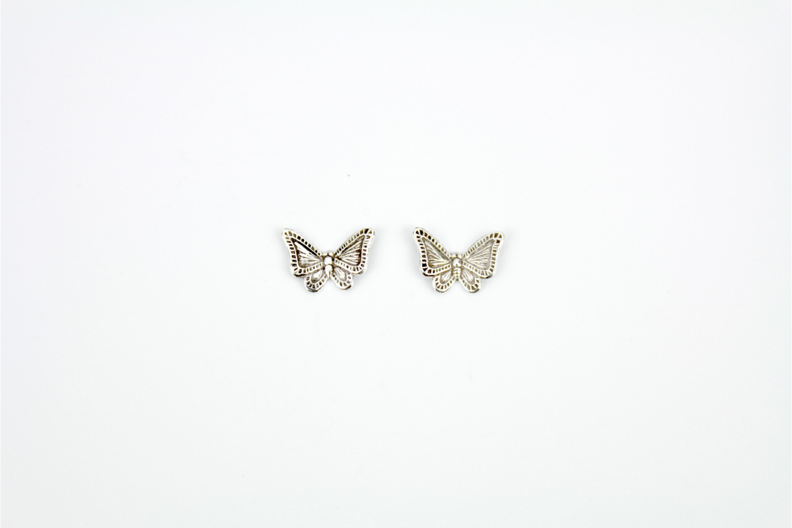Butterfly Aged Detailing silver stud earrings
